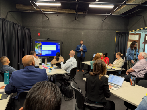 Dr. Geqigula Dlamini presenting an overview of his dissertation study to the Governor's Innovation Fellows