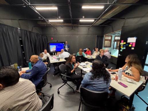 Governor's Innovation Fellows in discussion during Dr. Dlamini's dissertation overview